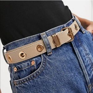 Beige belt eyelet detail